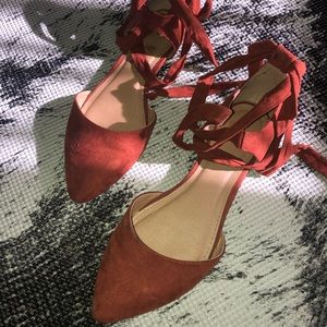 Tie up rusty orange flats